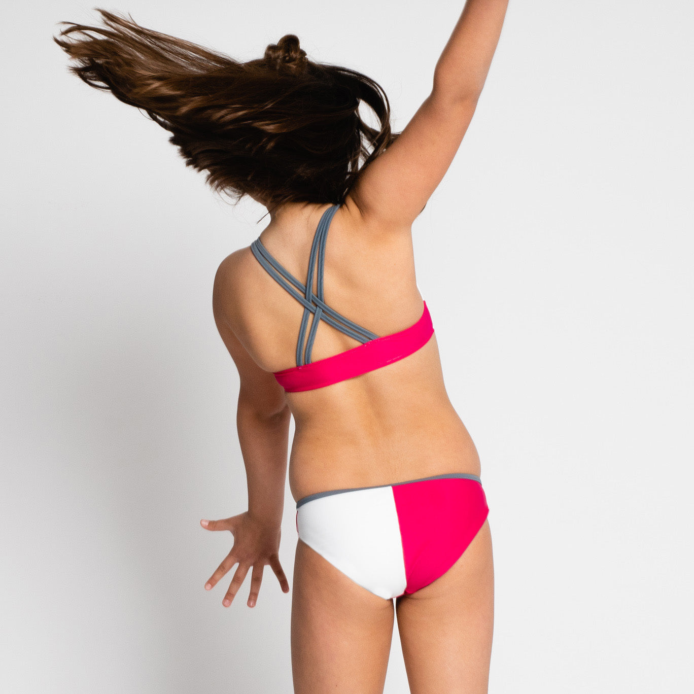 bikini de niña fucsia sostenible